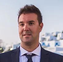 Aggelos wearing a suit